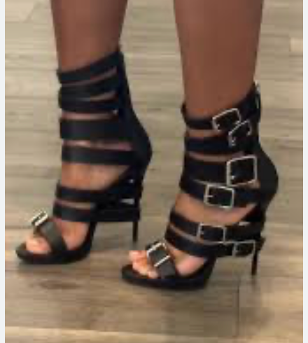 Giuseppe Zanotti black leather buckle strap heels.